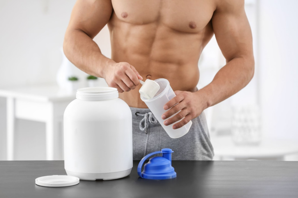 man preparing protein shake 