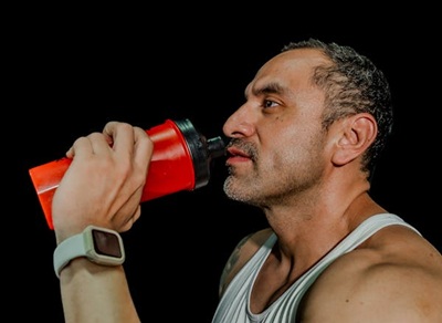 bodybuilder drinking protein shake